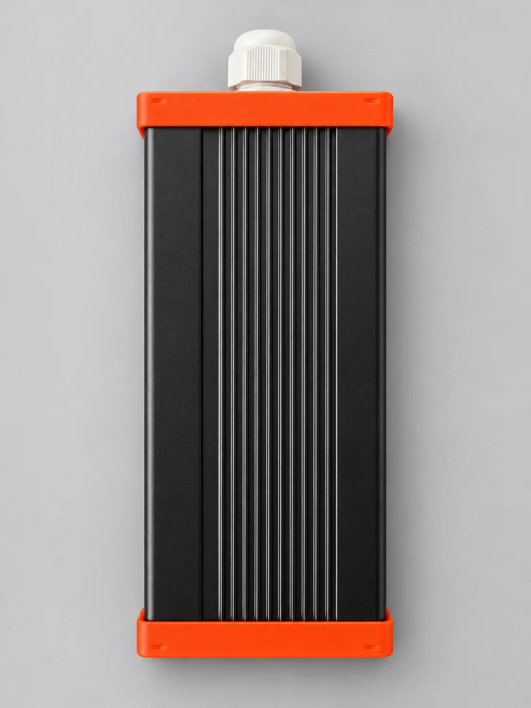Side view of the IEC-EVC-672N-6A charger with a ribbed black enclosure and orange end caps